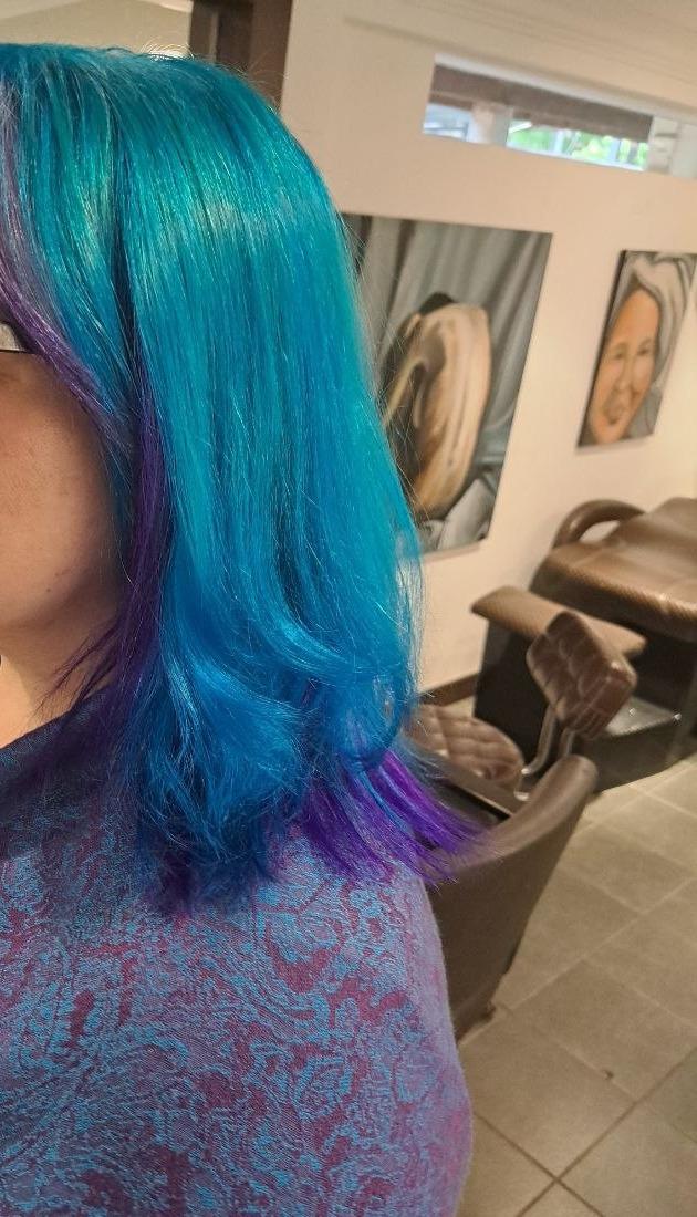 Shoulder-length hair in ocean blue, fading to violet at the ends