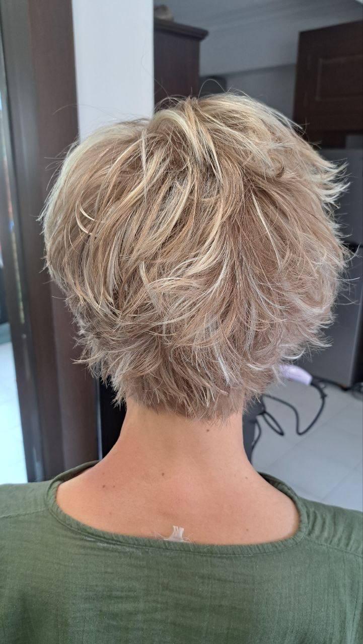 Back view of a short, textured crop with soft blonde highlights